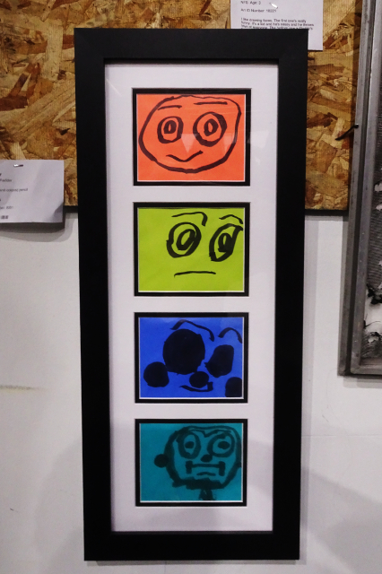 Four equally sized rectangles of different colors, stacked vertically, showing different faces drawn in a straightforward style with black ink. The faces each show expressions that combine apathy, fear, confusion, and satisfaction.